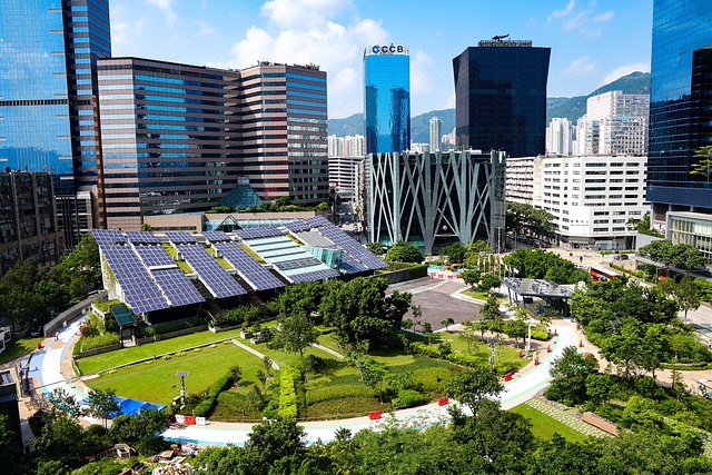 Urban park with solar panels amidst skyscrapers, showcasing eco-friendly sewer systems in a modern city.