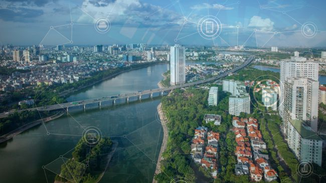 Futuristic smart city landscape featuring signs of urban gardens, conserved energy solutions like solar panels, and Wi-Fi hotspots, symbolizing the integration of sustainability, technology, and connectivity in modern urban development.